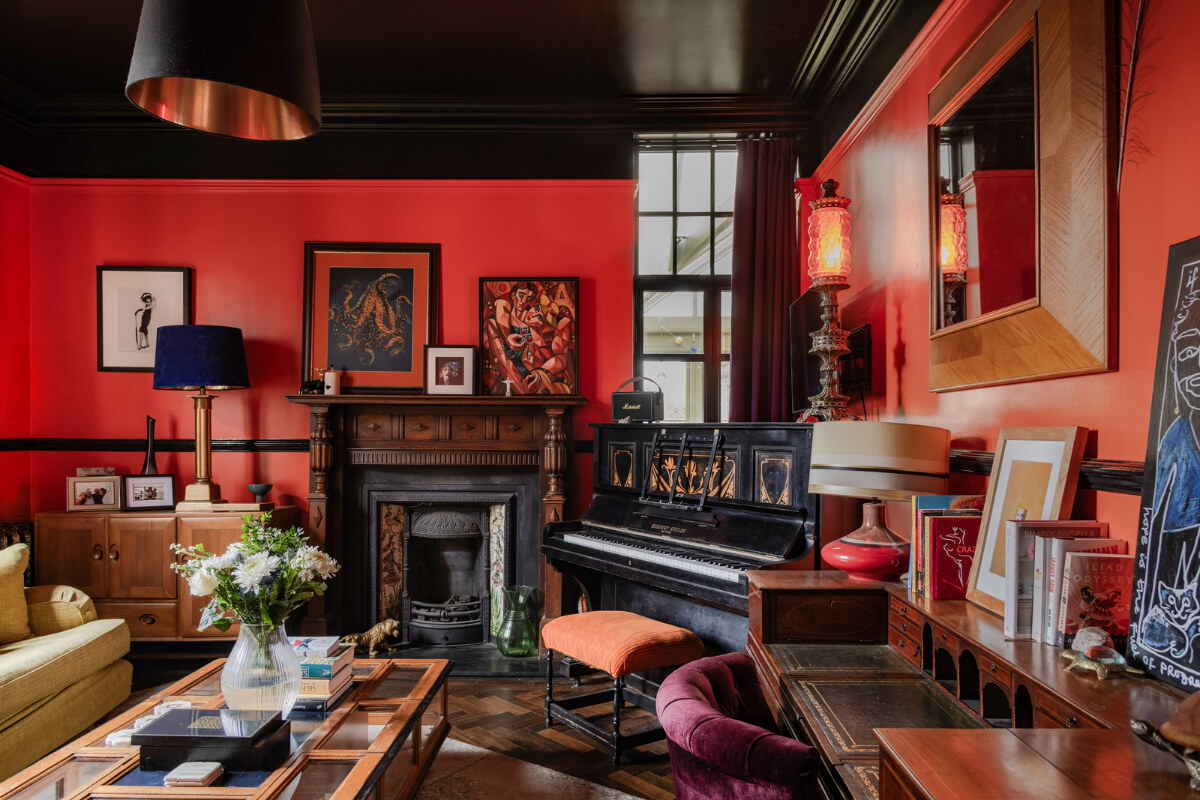 red sitting room with black ceiling nordroom