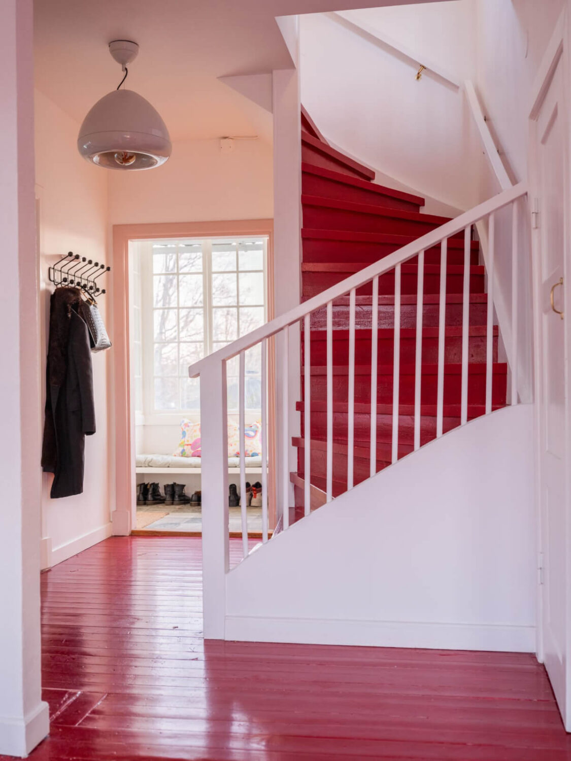 Painted Floorboards in a Unique Family Home in Sweden 16 red wooden floor and stairs