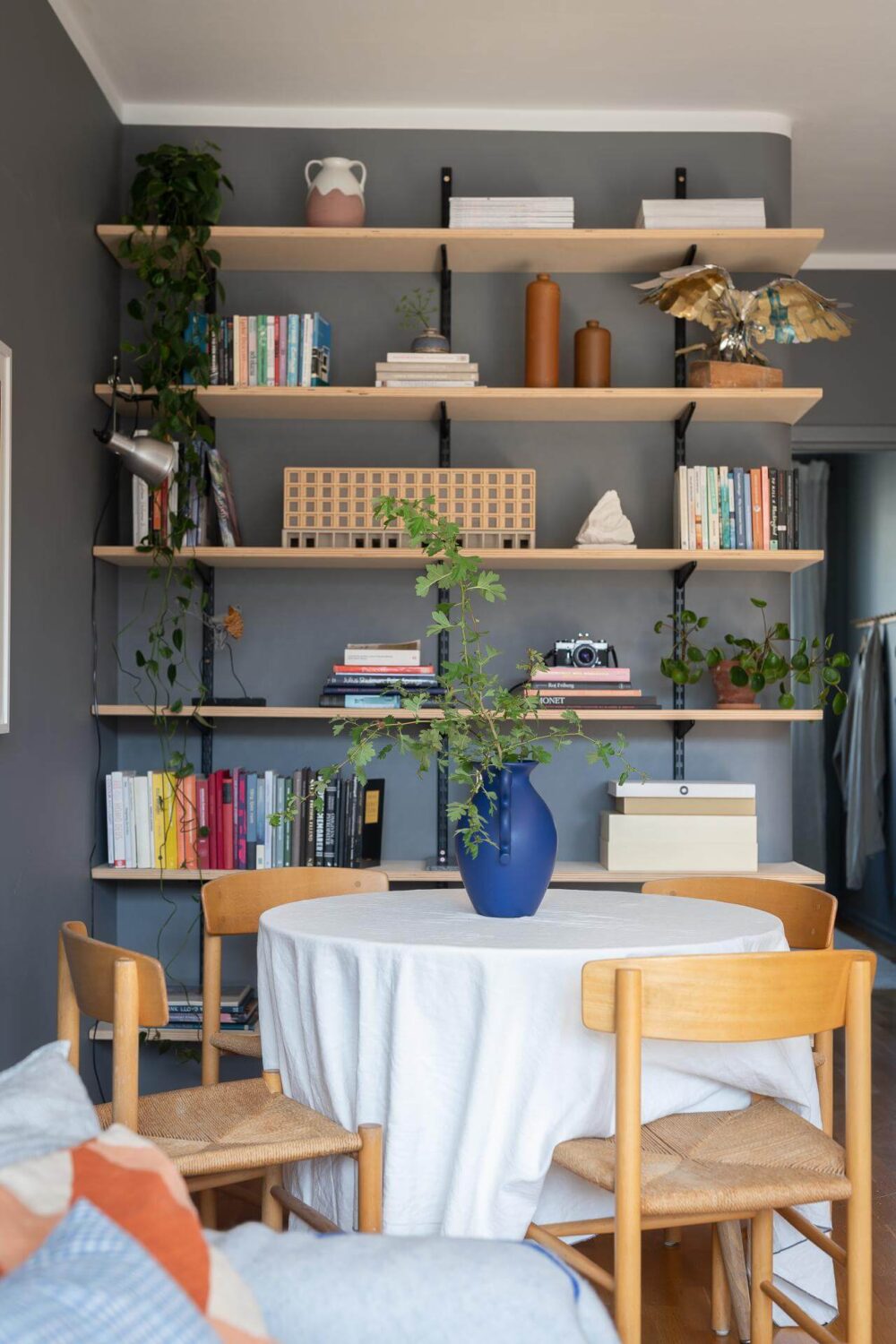 Light Rooms and a Moody Color Palette in a 1930s Apartment 12 round dining table shelves