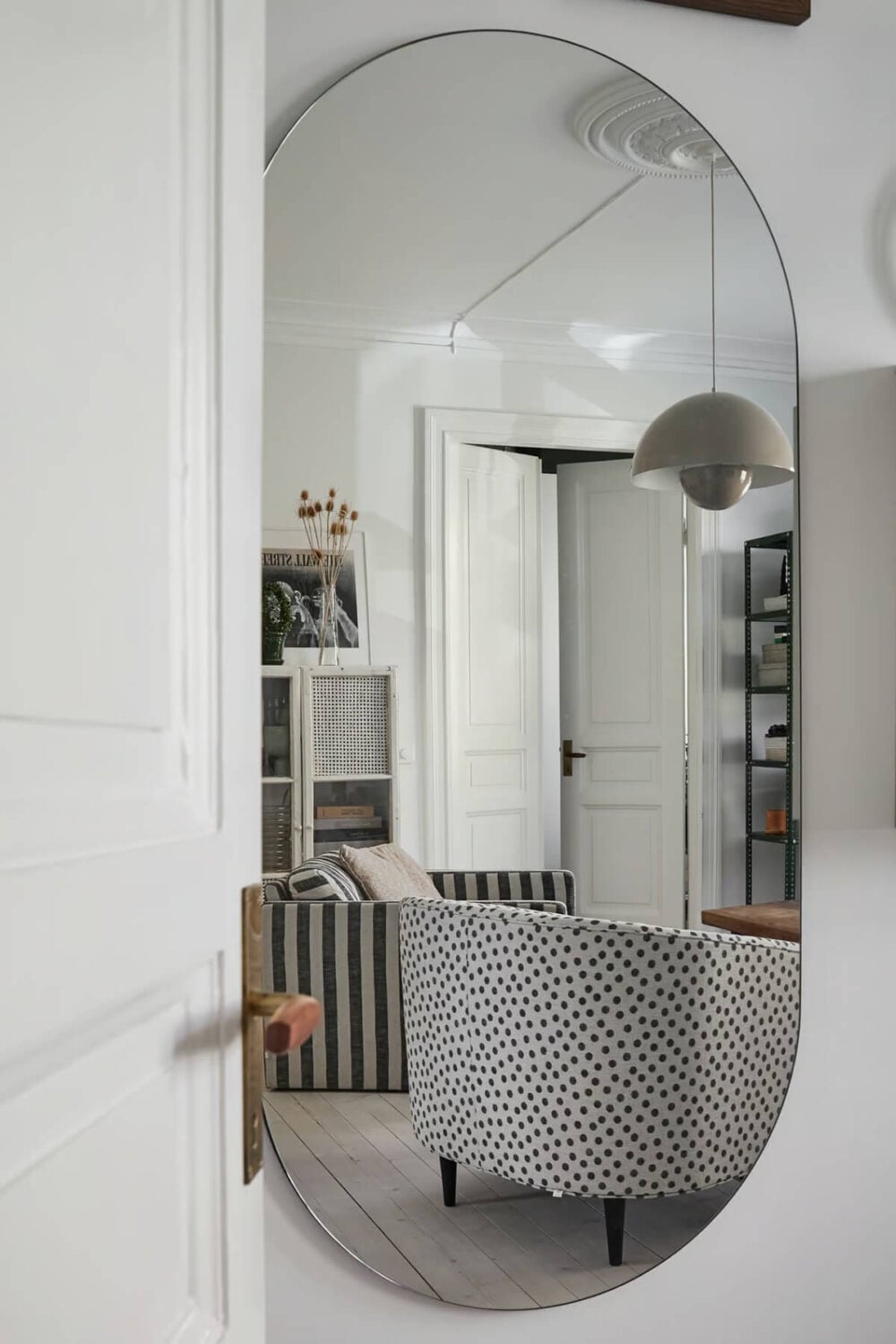 A Bright Turn-of-the-Century Apartment in Sweden 5 rounded mirror