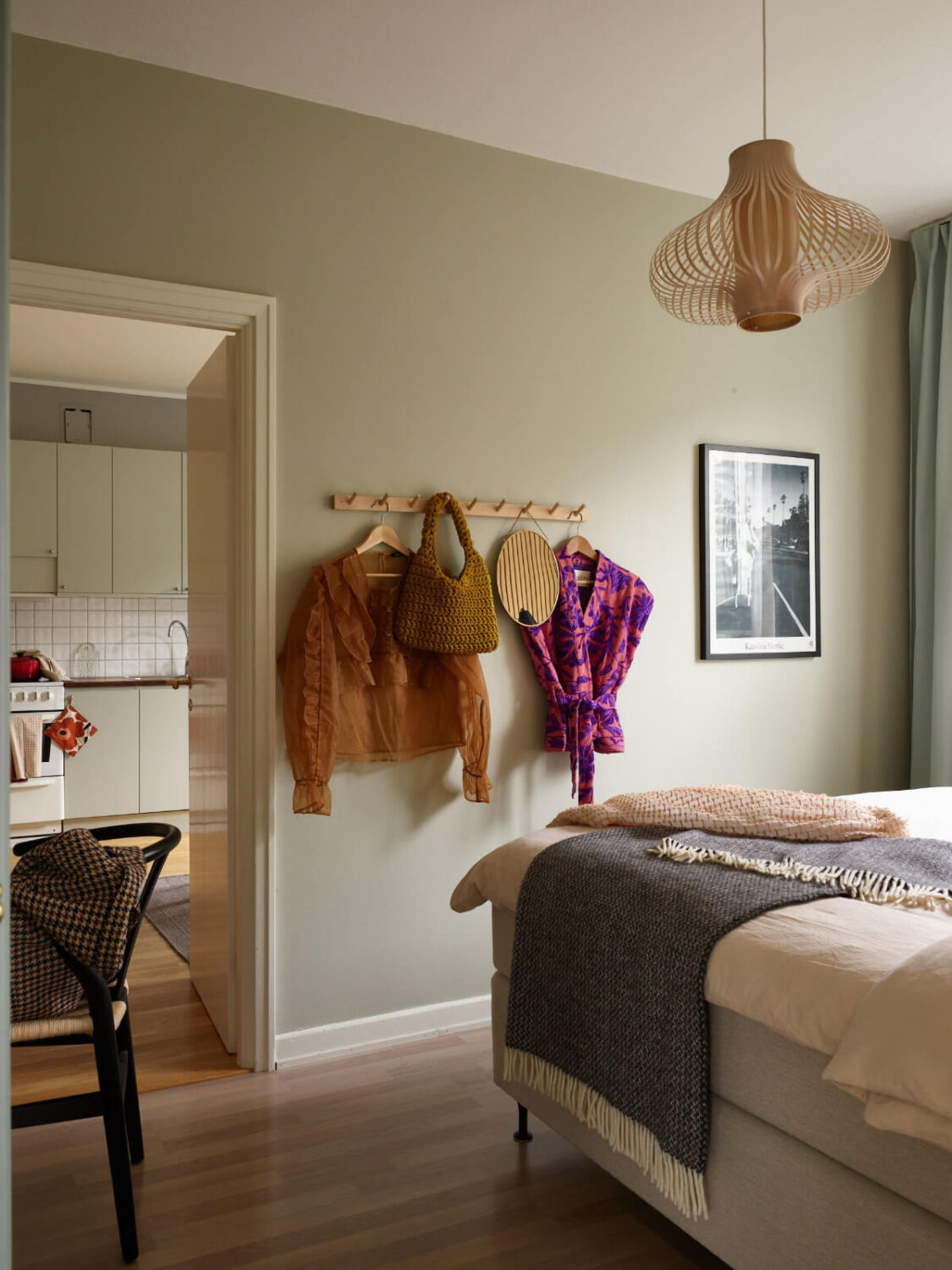 A Charming Two-Bedroom Corner Apartment in a 1940s Building 13 sage green bedroom