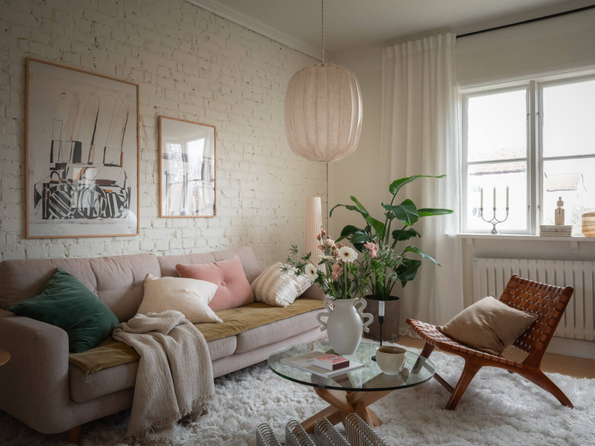 A Renovated Duplex Apartment with Exposed Brick Walls 2 scandi living room white painted brick wall