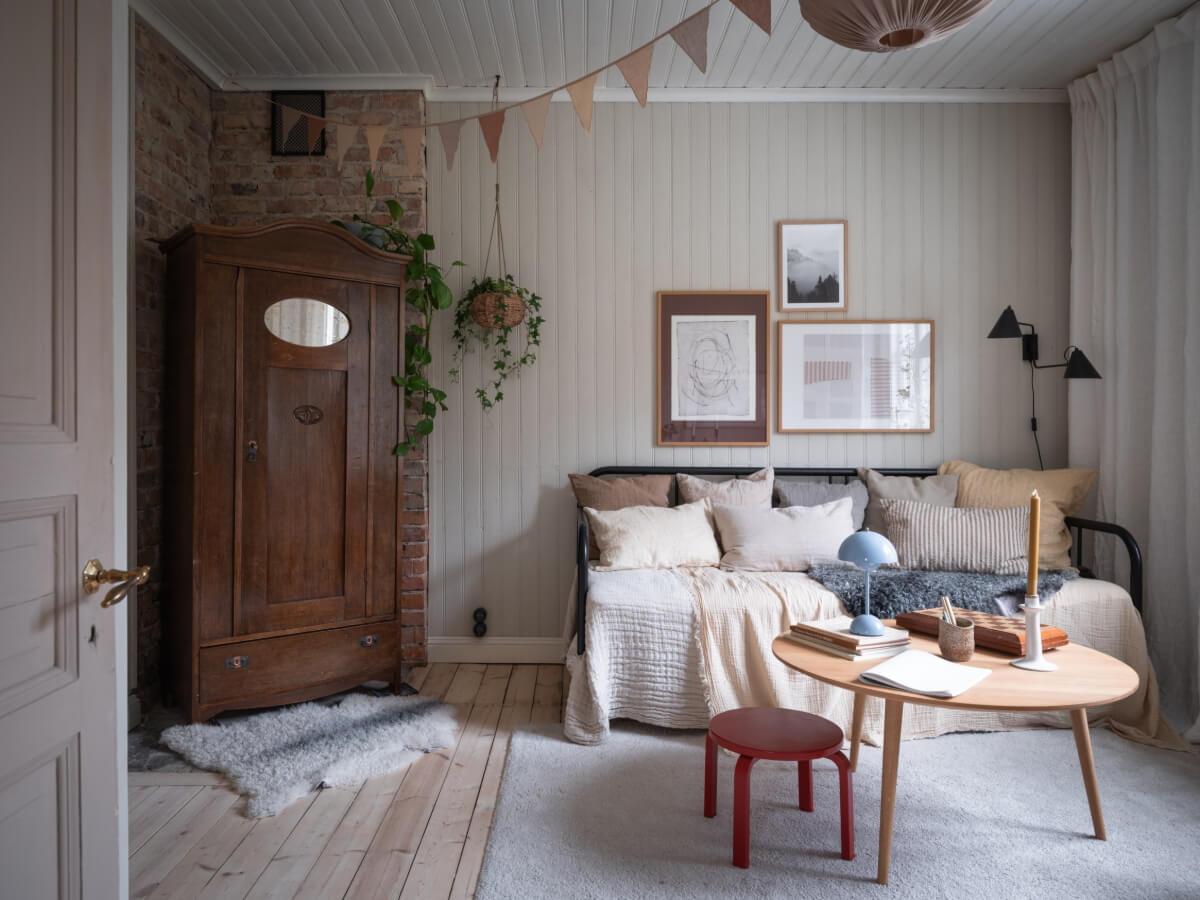 A Carefully Renovated Family Home in Sweden 19 scandi living room with paneled and brick walls