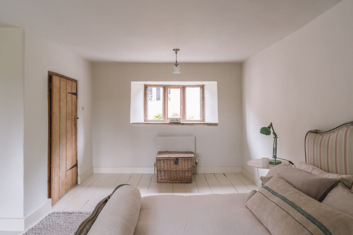 A Beautiful Renovated Country House in England 27 serene bedroom rustic wooden door