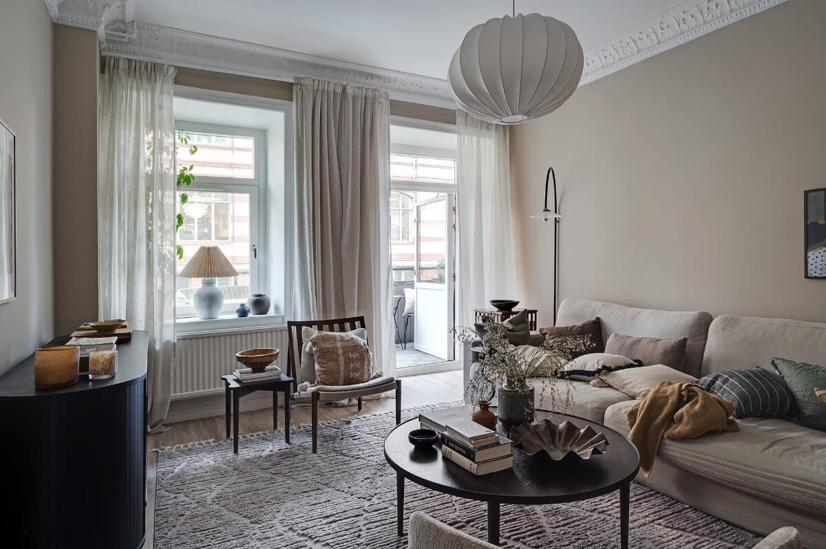Warm and Inviting Rooms in a Renovated Swedish Apartment 2 serene scandi living room warm beige walls