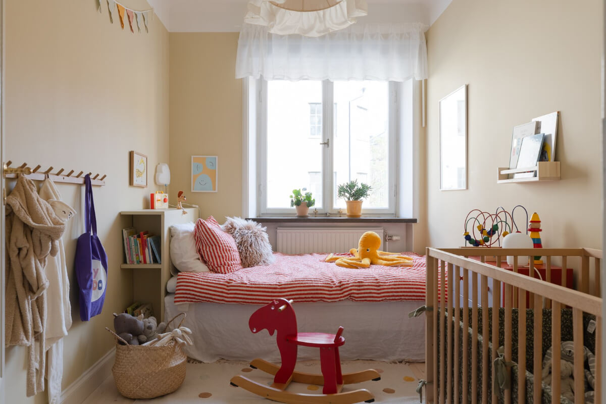 Modern Interiors in a Bright 1930s Apartment in Sweden 30 shared kids bedroom beige-yellow walls