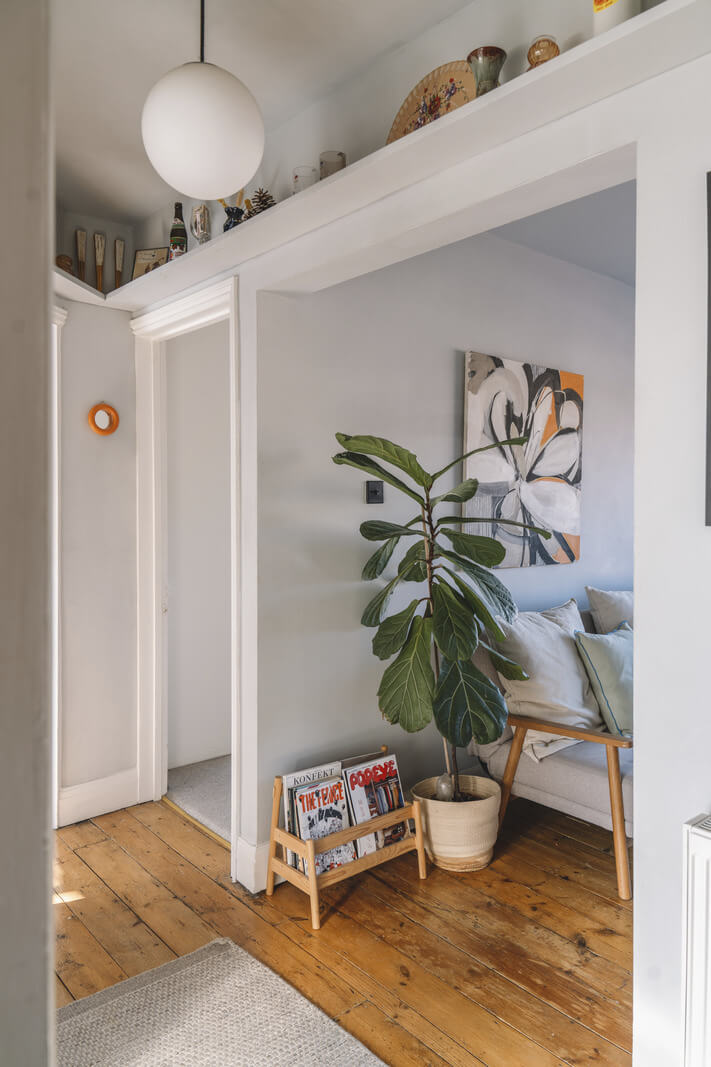 A London Apartment with a Pink and Green Kitchen 12 shelf above doorframes