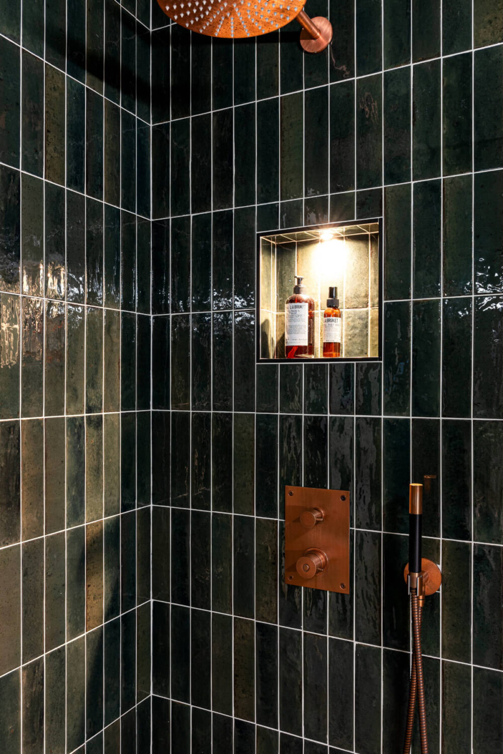 An Elegant Stockholm Apartment with a Pink and Black Kitchen 22 shower niche with spotlight