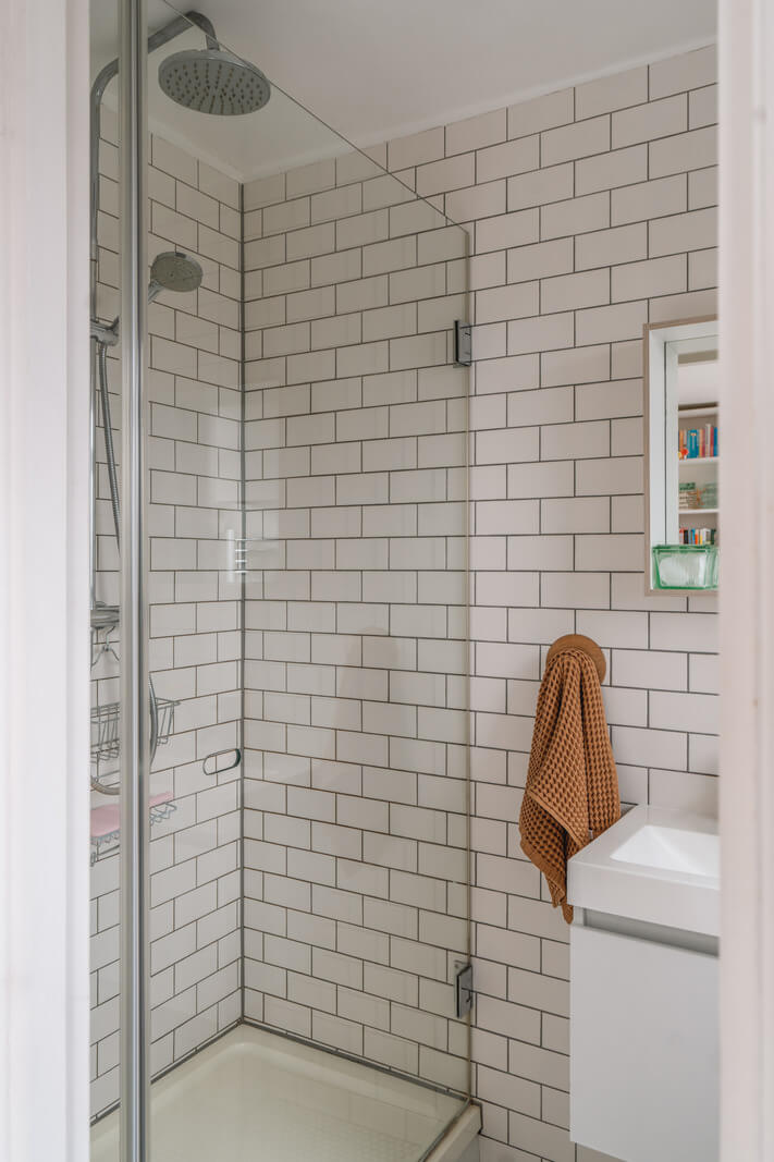 A Charming Light Edwardian House with a Tiny Garden 19 shower white subway tile