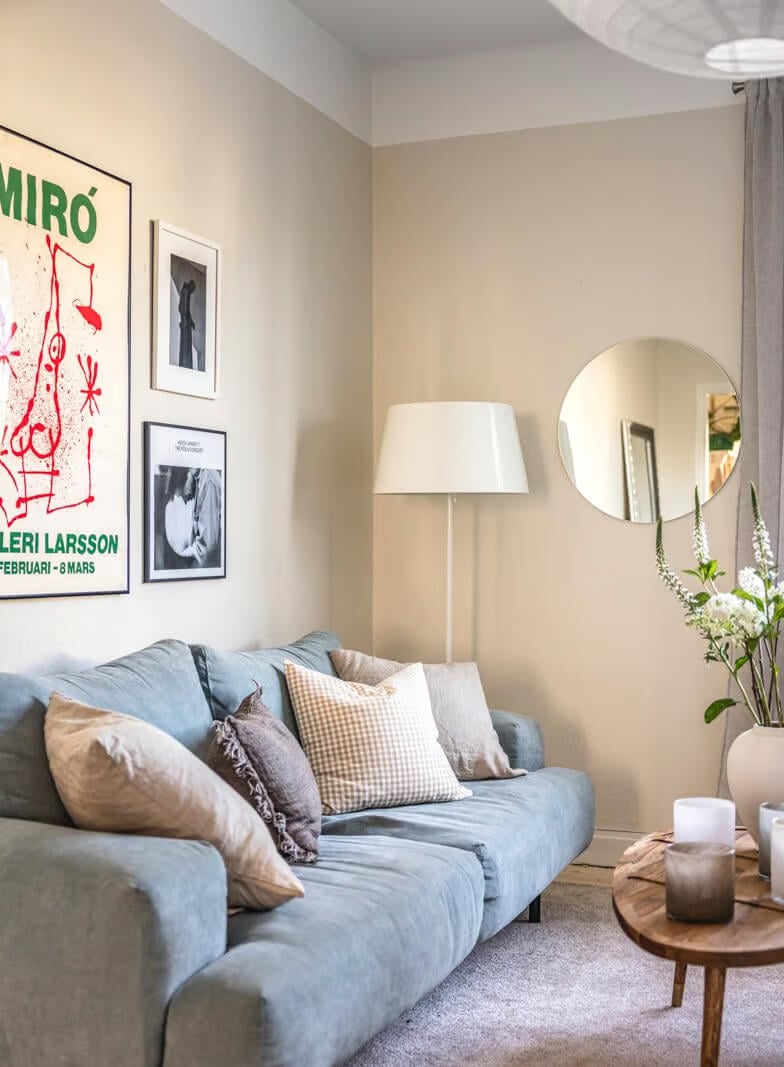 A Beige Studio Apartment with a Bright Kitchen 2 sitting area studio beige walls