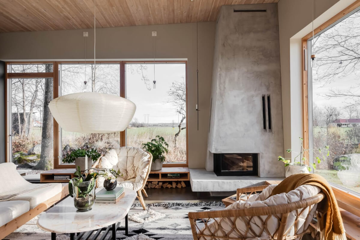 A Swedish Architectural Villa Surrounded by Nature 2 sitting room corner fireplace