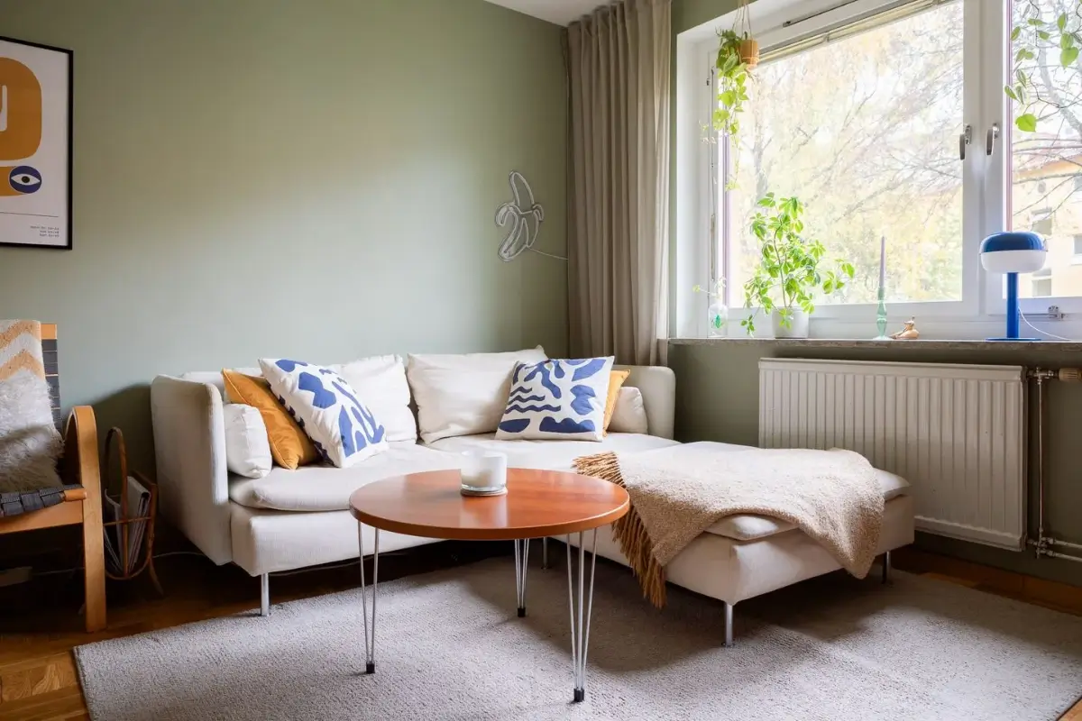 A Swedish Apartment with a Dutch Parquet Floor and Terracotta Bedroom 3 sitting room sage green walls