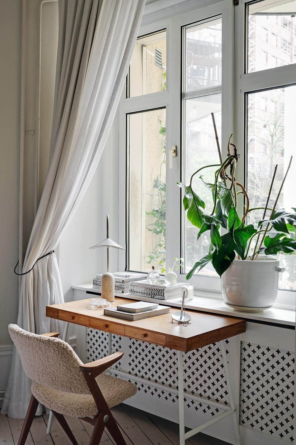 Period Features and Modern Materials in a Swedish Apartment 19 small desk under window