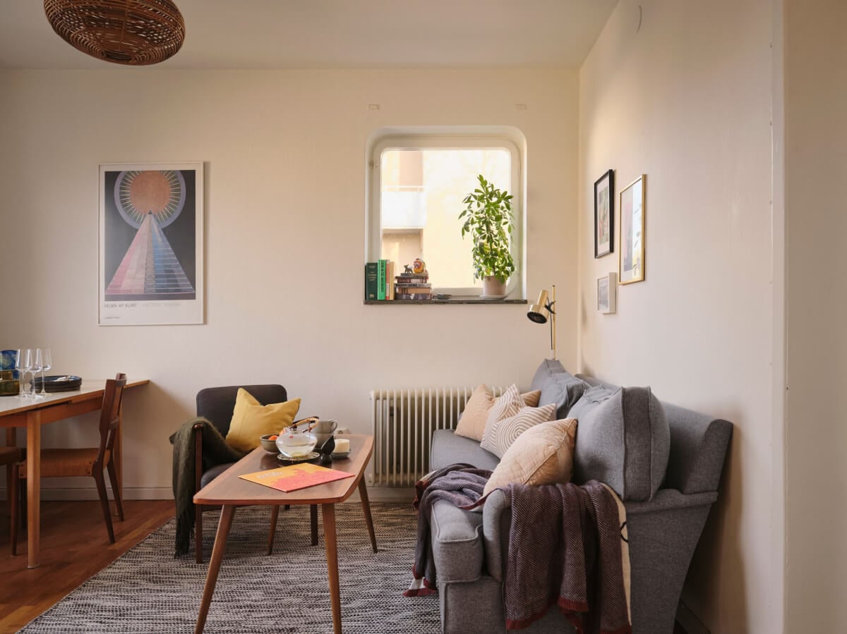 A Small, Light Swedish Apartment with Midcentury Features 1 small living room gray rug