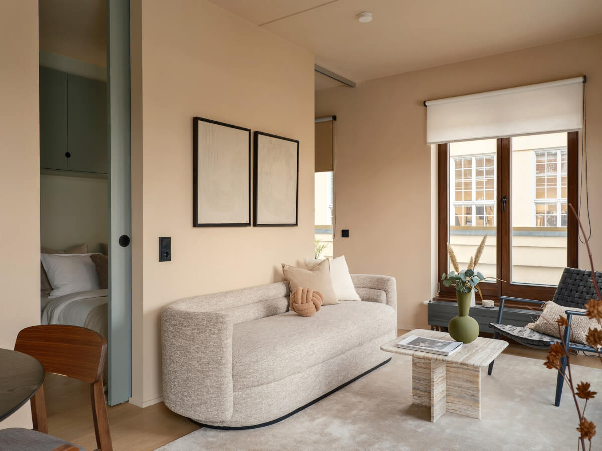 A Small Modern Stockholm Apartment with Smart Storage Solutions 6 small living room sliding door to bedroom