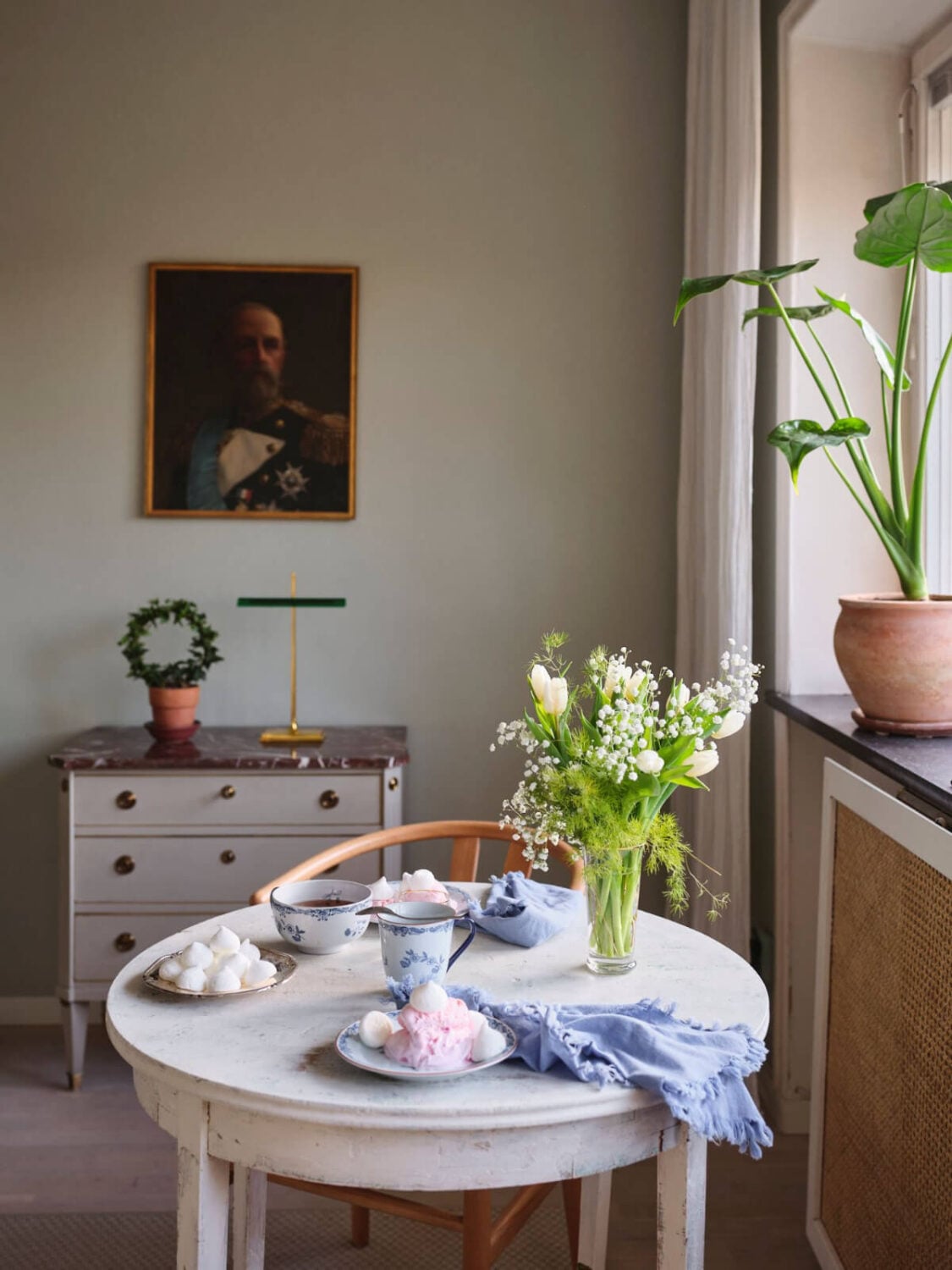 A Small Stockholm Apartment with a Tiny Green Bedroom 9 small round table detail