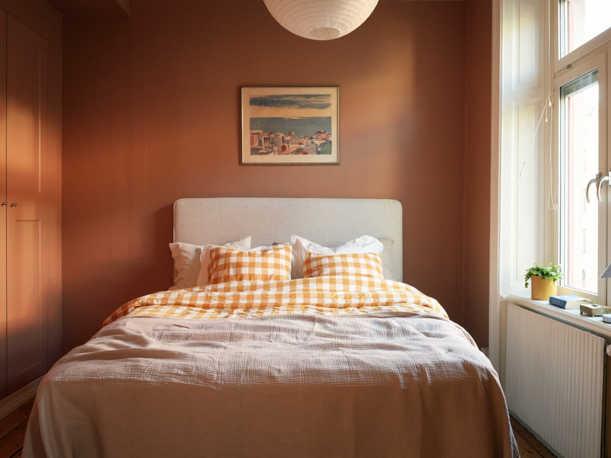 A Charming Historic Stockholm Apartment with a Blue Kitchen 22 small terracotta bedroom with built-in wardrobes