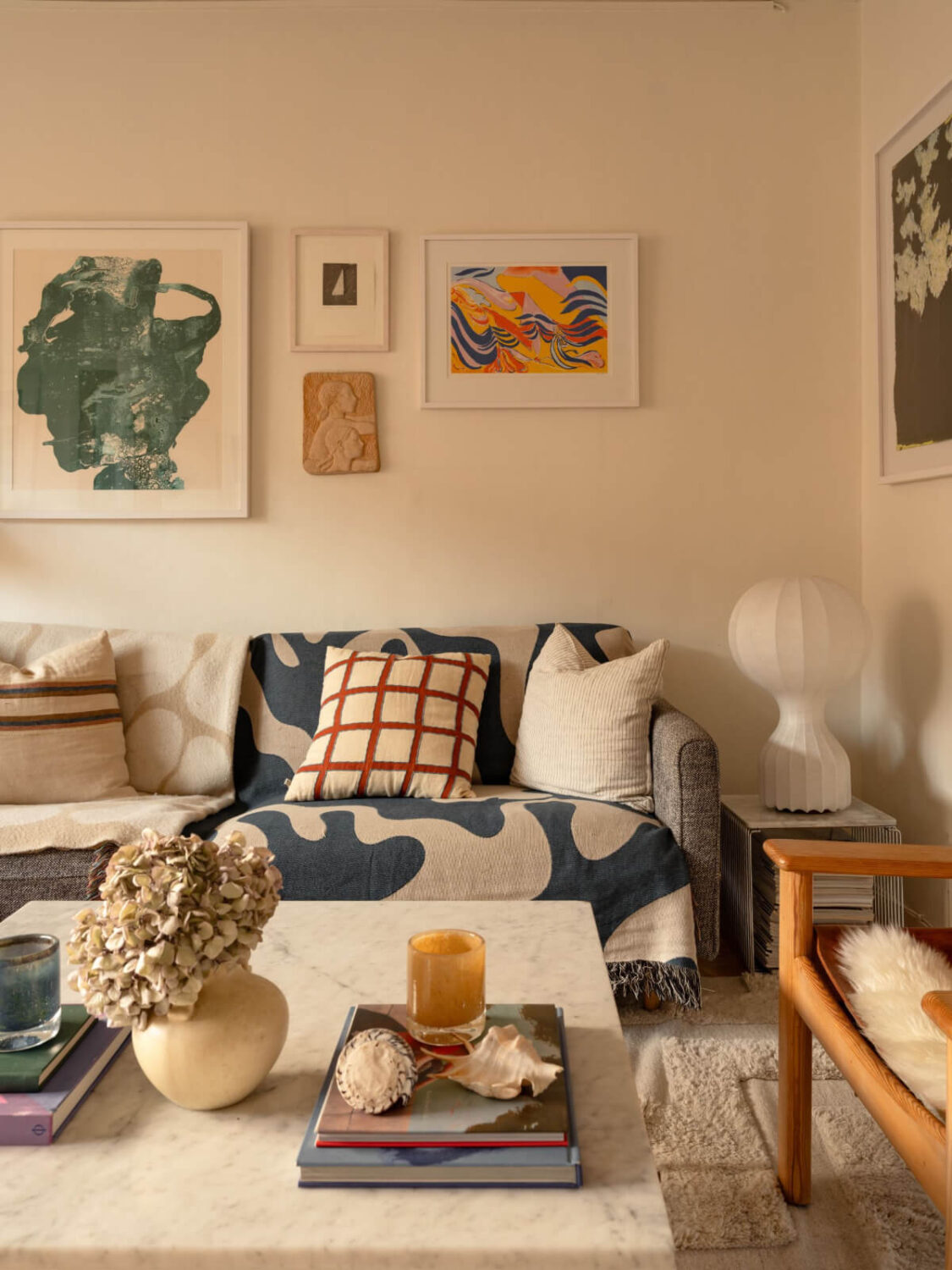 A Charming Midcentury Apartment with a Reading Room 4 sofa with graphic throw