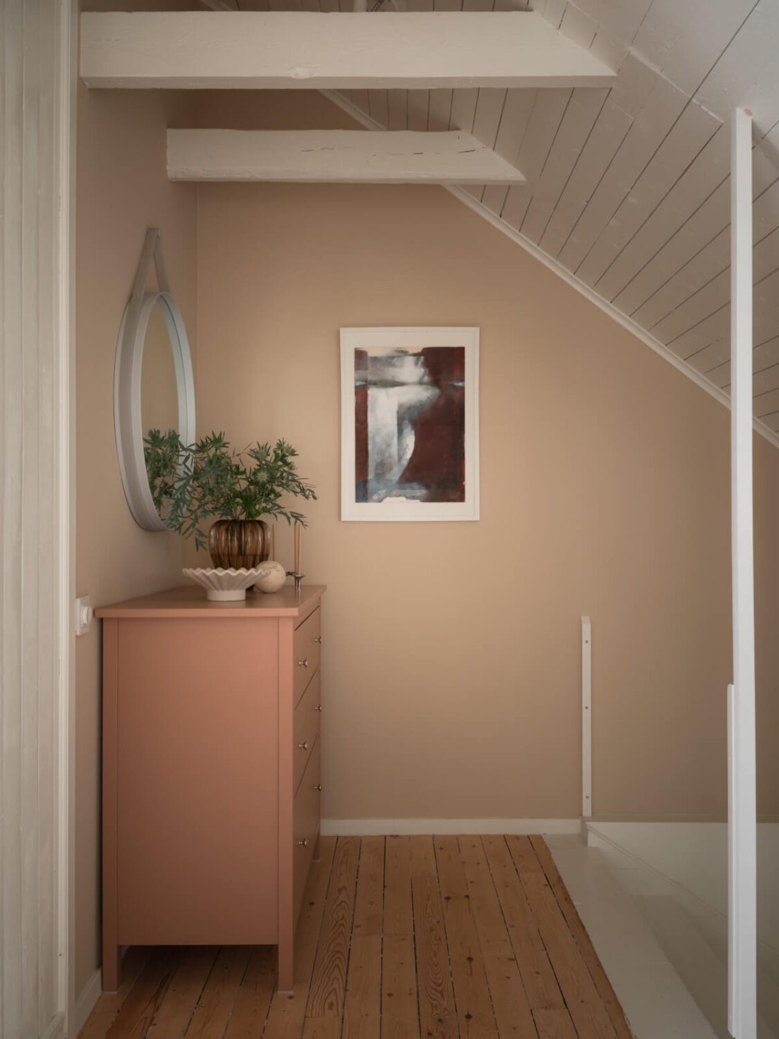 A Renovated Duplex Apartment with Exposed Brick Walls 15 soft pink attic floor