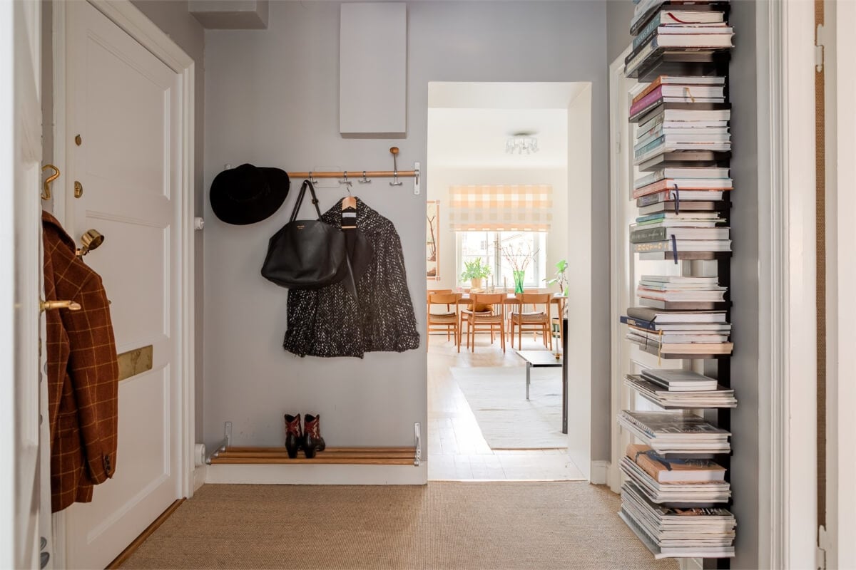 A Light-Filled Two Bedroom Apartment in Stockholm 21 spacious hall bookshelves A Light-Filled Two Bedroom Apartment in Stockholm