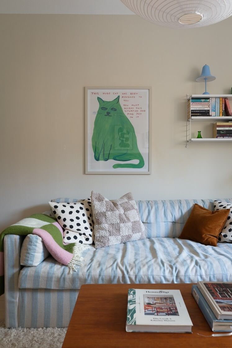 Modern Interiors in a Bright 1930s Apartment in Sweden 17 striped sofa light blue