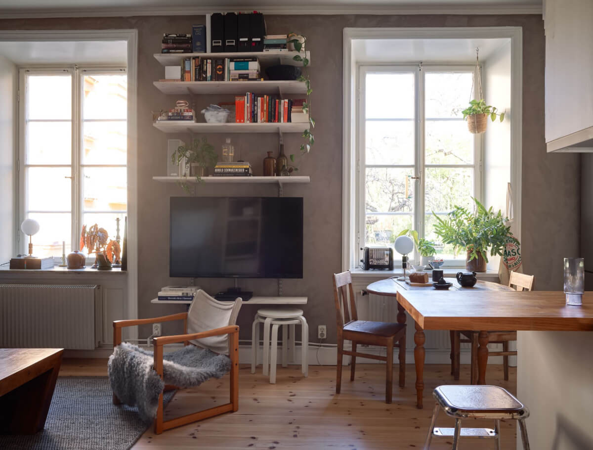 A Studio Apartment with Smart Storage Ideas and Exposed Brick 6 studio apartment gray walls shelves