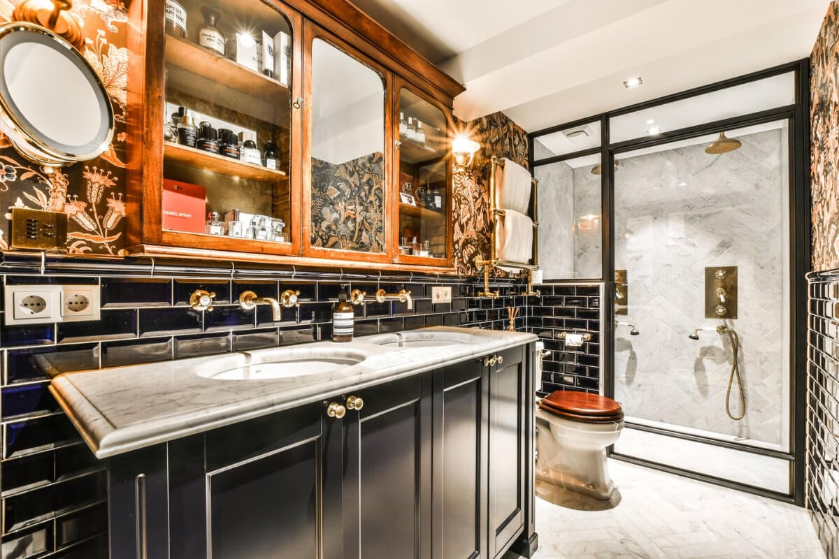 A Unique Ground Floor Duplex Apartment in Amsterdam 24 stylish bathroom wallpaper dark subway tiles brass fittings