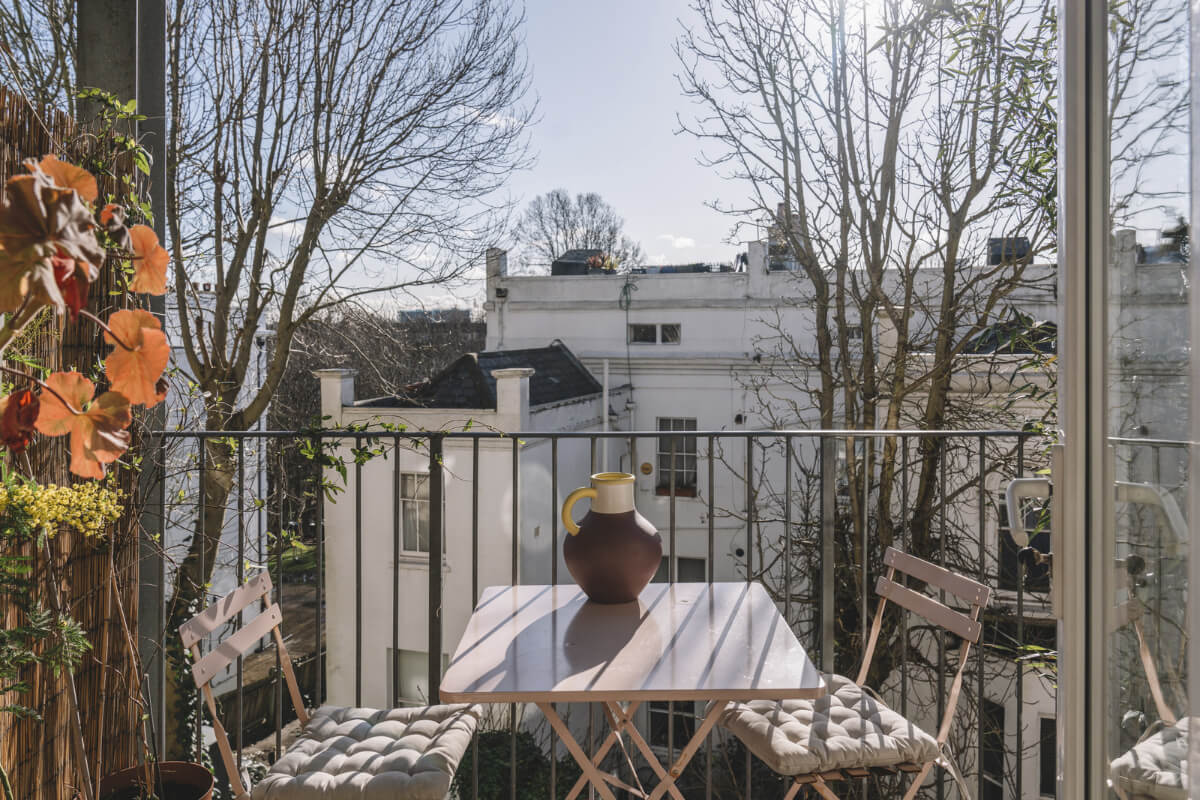 A London Apartment with a Pink and Green Kitchen 10 sunny balcony