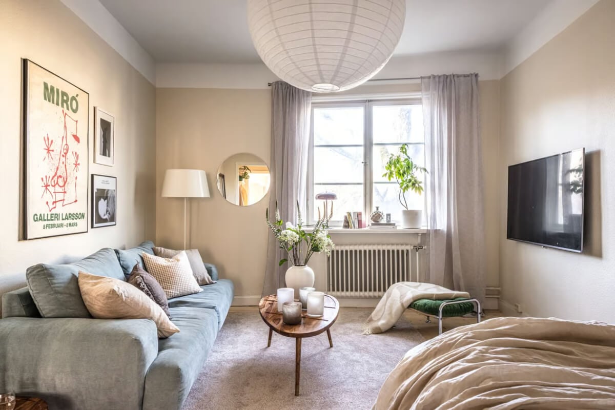 A Beige Studio Apartment with a Bright Kitchen 1 swedish studio beige walls
