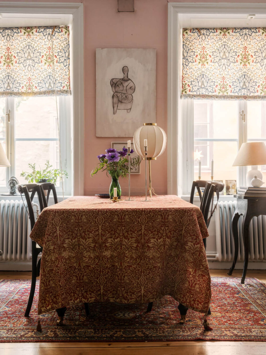 A Charming Home in a 17-Century Apartment in Stockholm's Old Town 10 table in pink living room