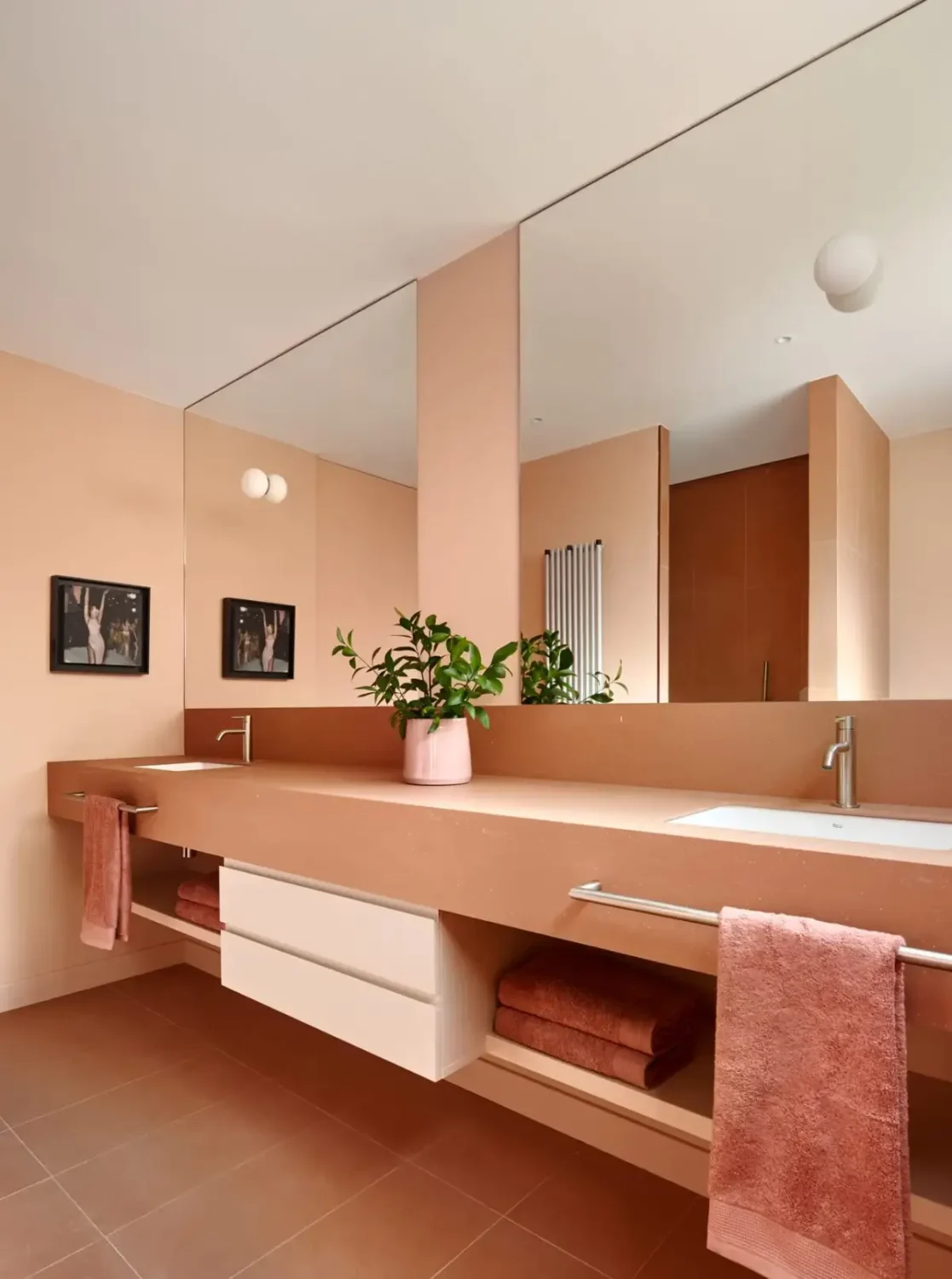 A Modern Barcelona Apartment with a Pink Bathroom 18 terracotta colored bathroom double sink