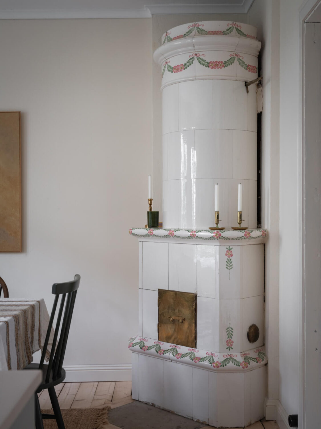A Carefully Renovated Family Home in Sweden 16 tiled painted fireplace
