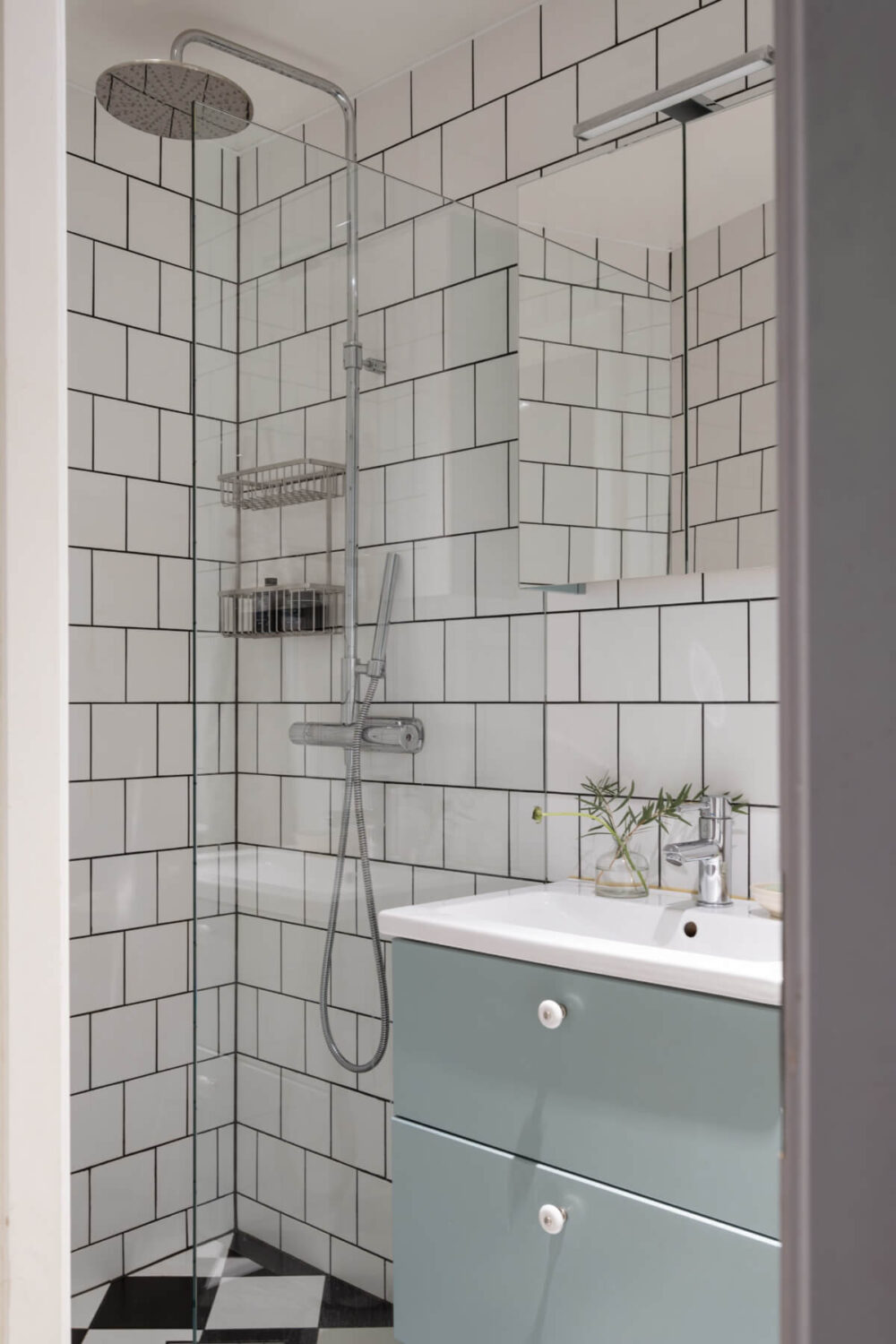 A Swedish Maisonette Apartment with Basement Bedrooms 16 tiny bathroom white subway tiles checkerboard floor