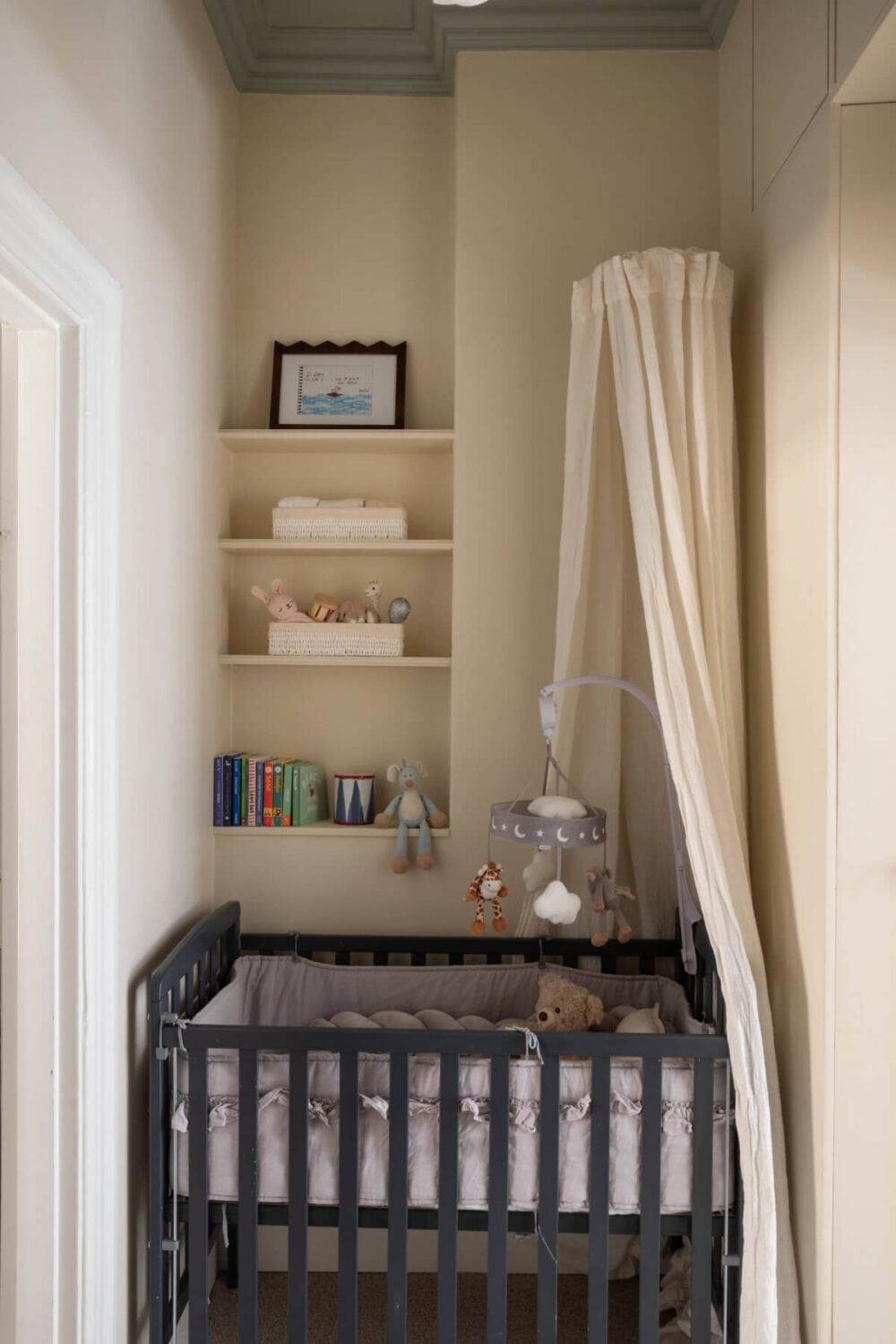 A Calm, Neutral Color Palette in a Classic Swedish Apartment 21 tiny beige nursery with built-in shelves