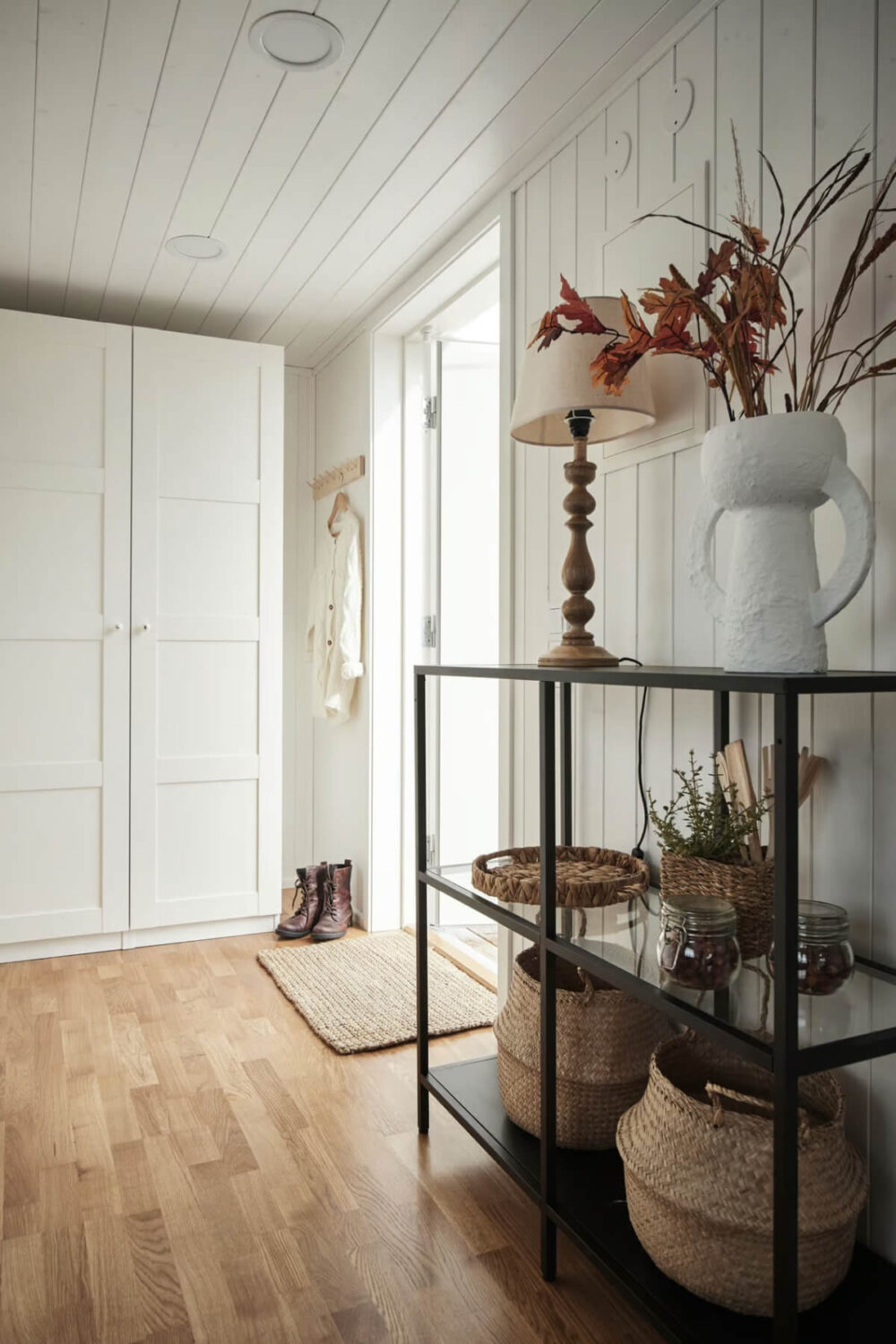 A Charming Tiny House in Sweden with a Private Terrace 14 tiny house hall with wardrobes