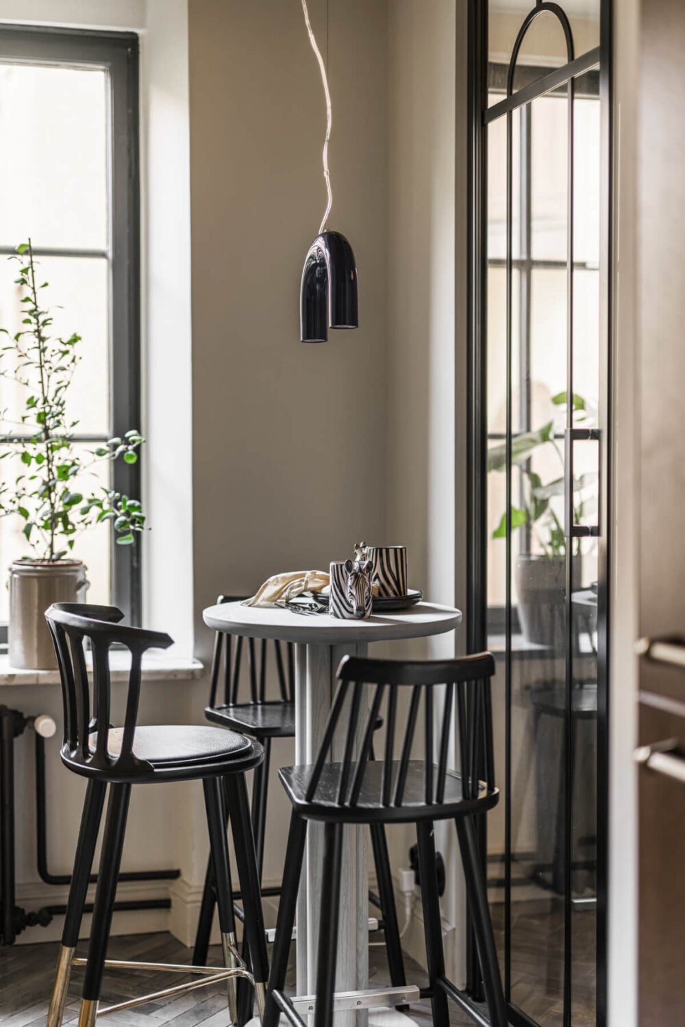 A Swedish Apartment with Exclusive Materials and Monochrome Color Scheme 10 tiny kitchen bar table