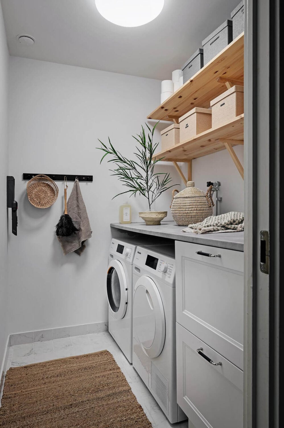 Warm and Inviting Rooms in a Renovated Swedish Apartment 28 utility room wooden shelves