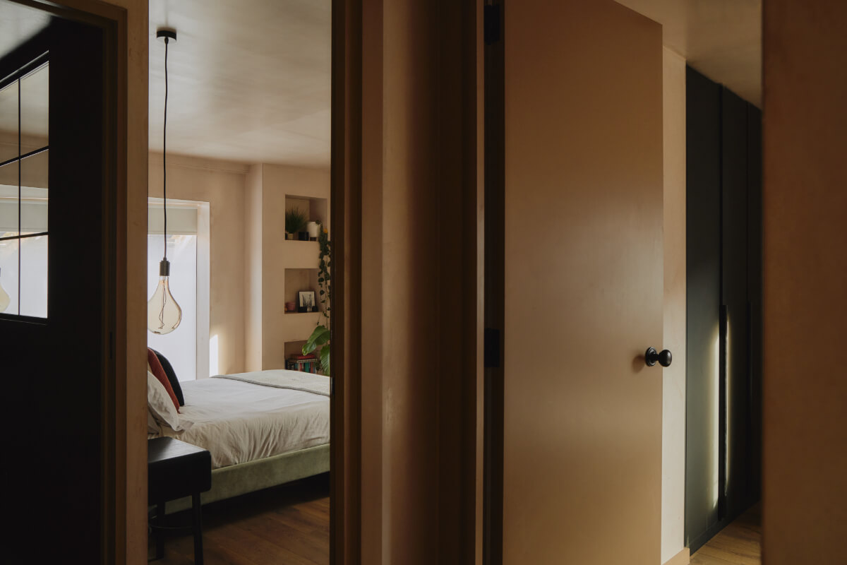 An Elegant Apartment with Plaster Walls and a Winter Garden 21 view into bedroom