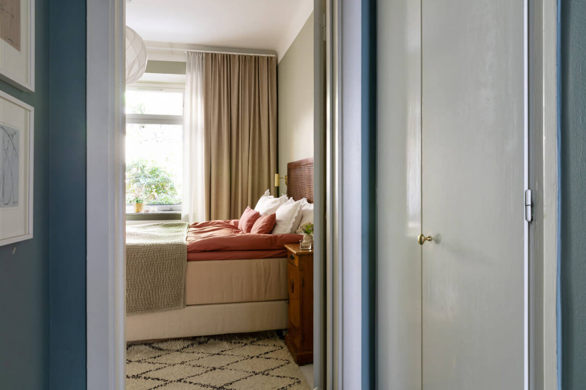 A Charming Ground Floor Apartment with a Large Patio Garden 12 view into bedroom