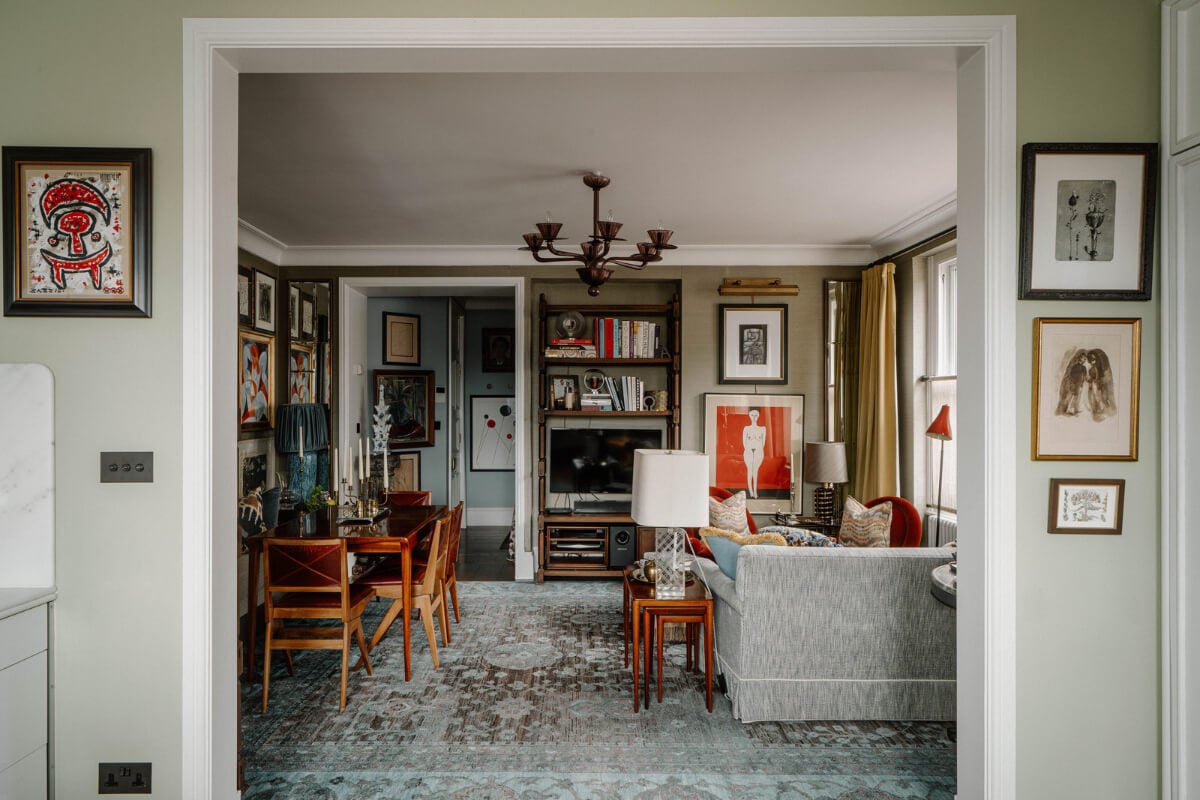 A Cozy Art-Filled Attic Apartment in London 7 view into cozy living room with large blue toned rug