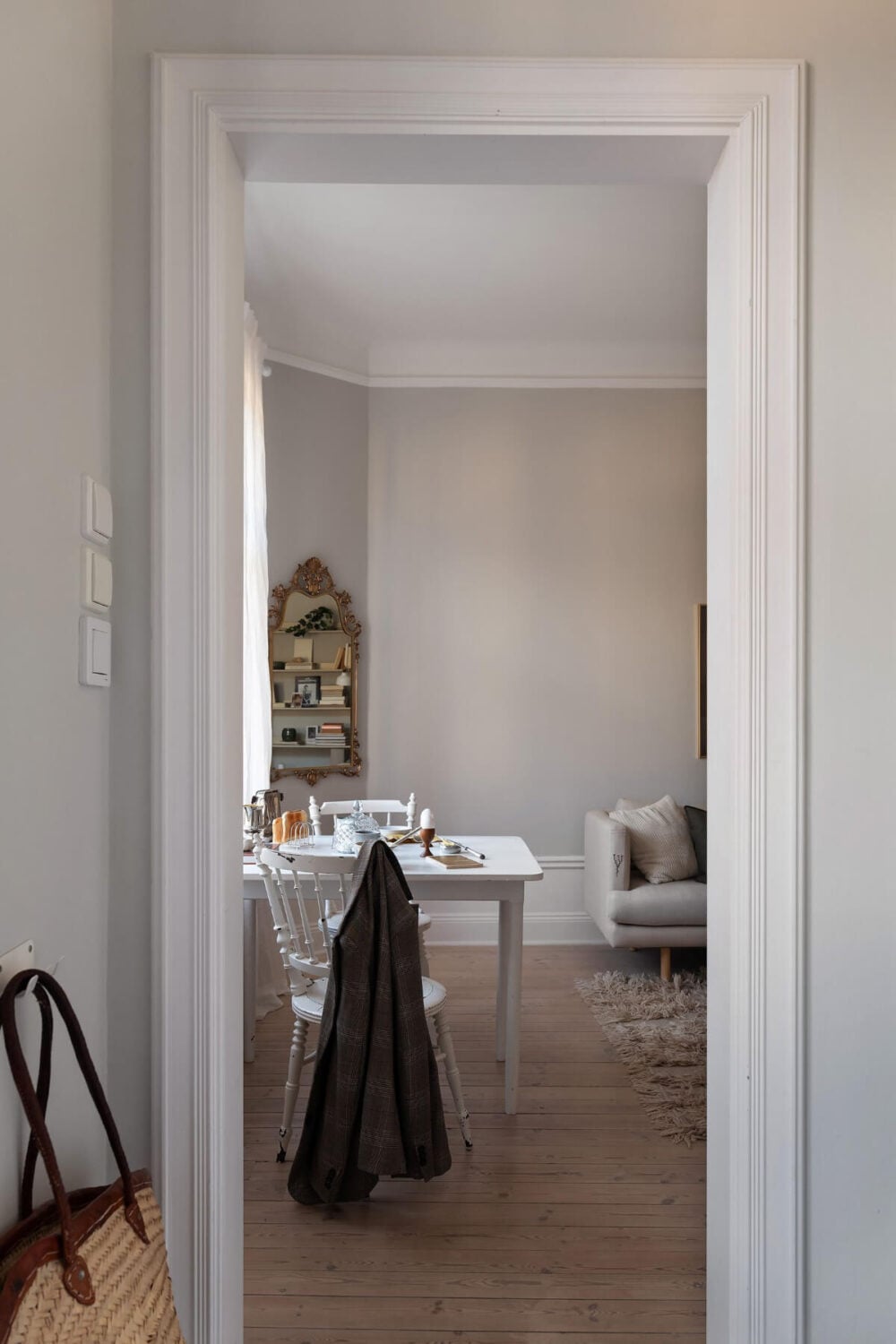 A Small Light Gray Apartment with Period Features 13 view into living room