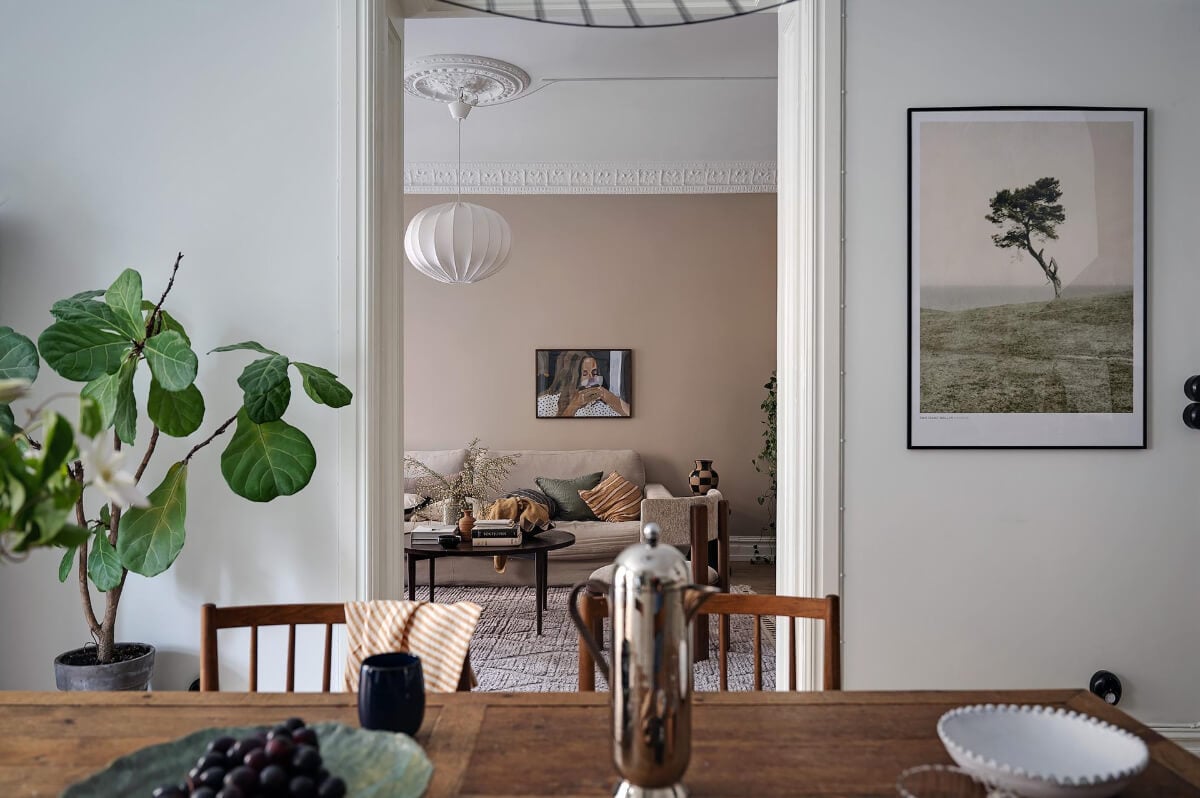 Warm and Inviting Rooms in a Renovated Swedish Apartment 17 view into living room