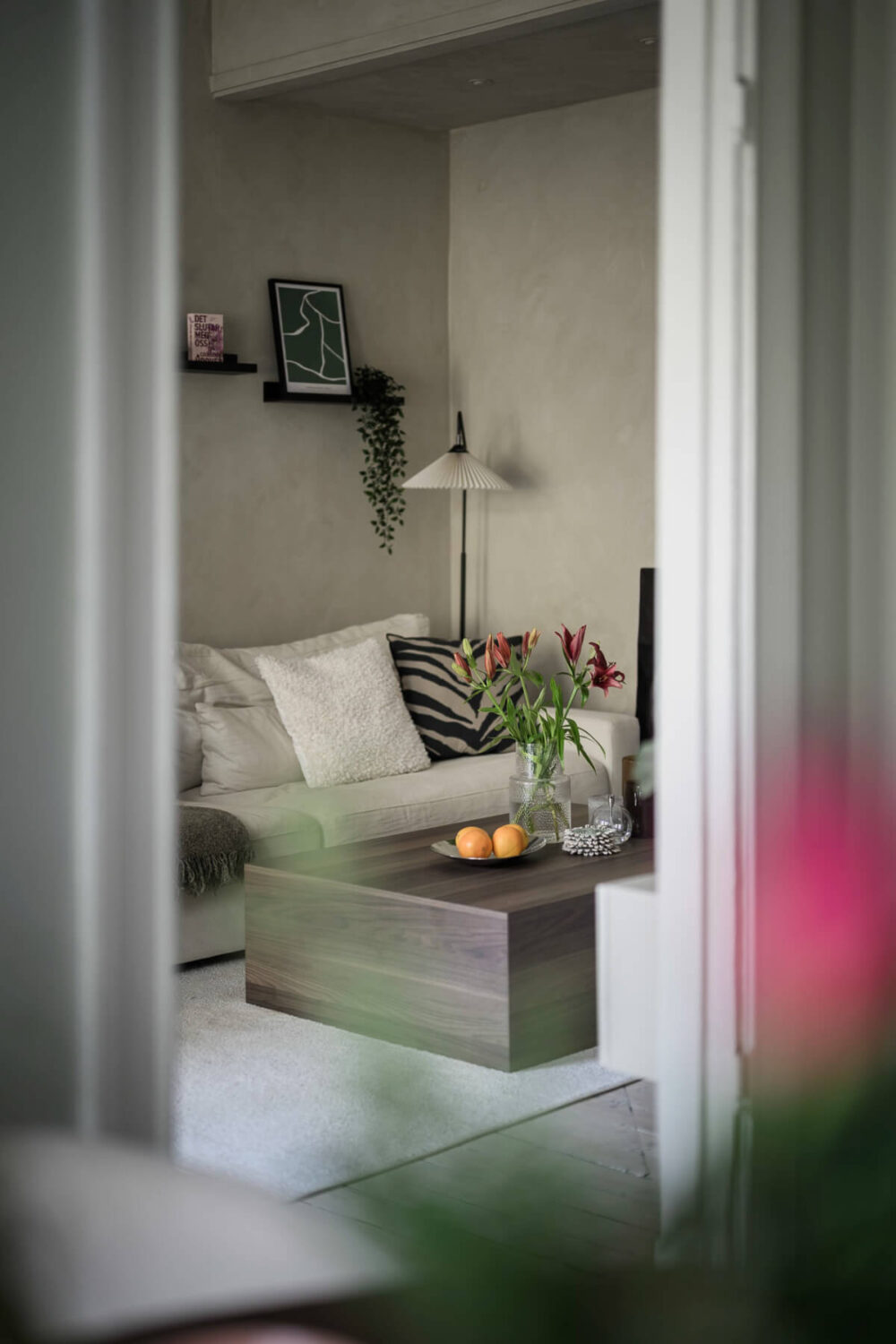 Limewash Wall and Period Features in a Swedish Apartment 6 view into living room