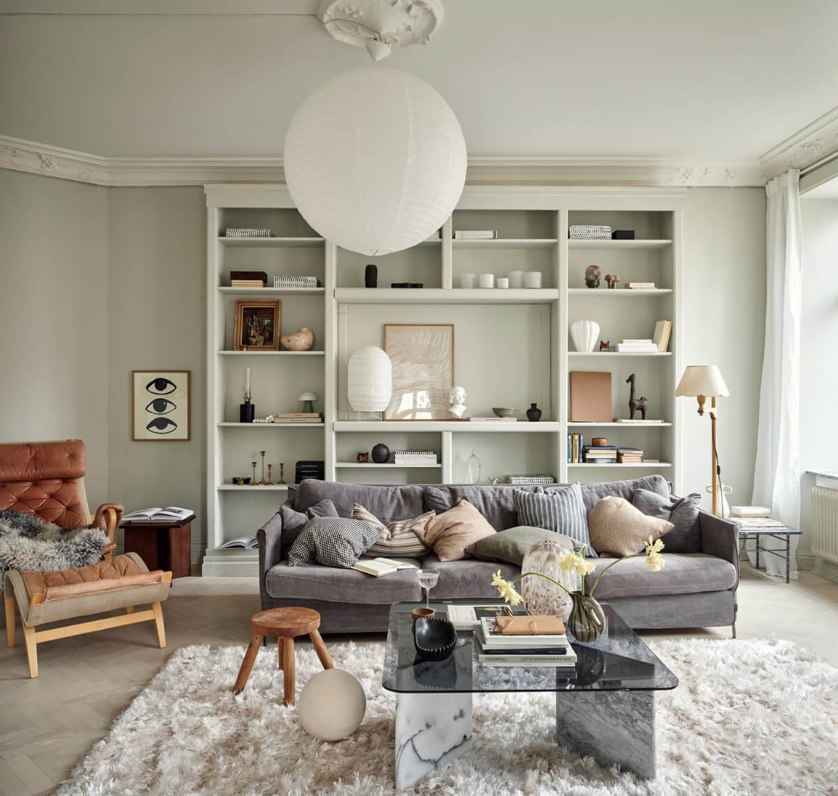 A Light Scandi Apartment in a Former Stately Home 3 view into living room custom bookcase