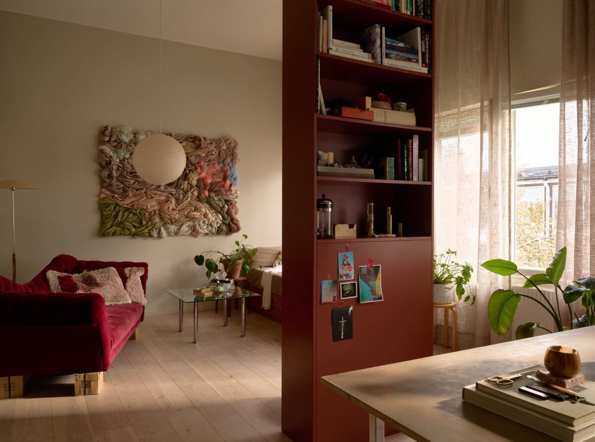 High Ceilings in a Small Swedish Loft Designed for a Family 8 view into sitting room