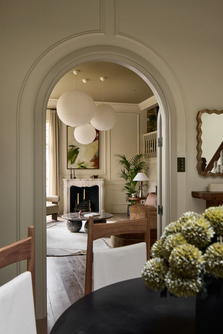 A Stunning Victorian House with Period Features and Surprising Spaces 6 view through arched doorway into living room