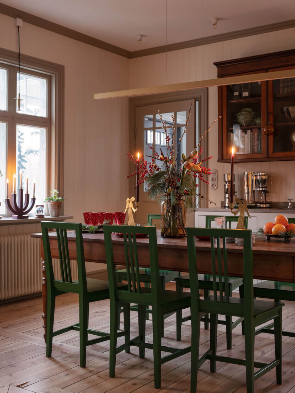 A Beautiful Turn-of-the-Century Family Home in Sweden 19 vintage wooden kitchen table green chairs
