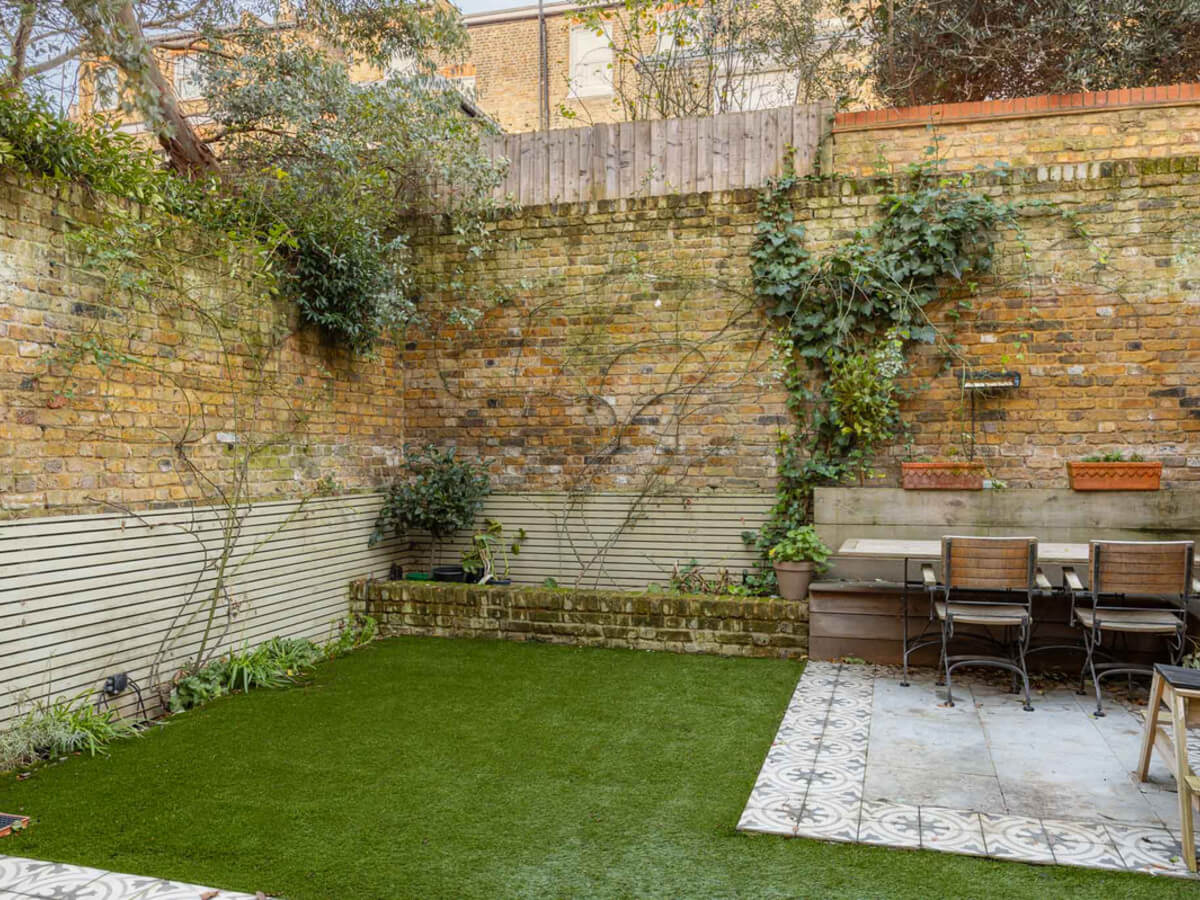 An Extended Family Home in London with Pink Crittall Doors 16 walled garden