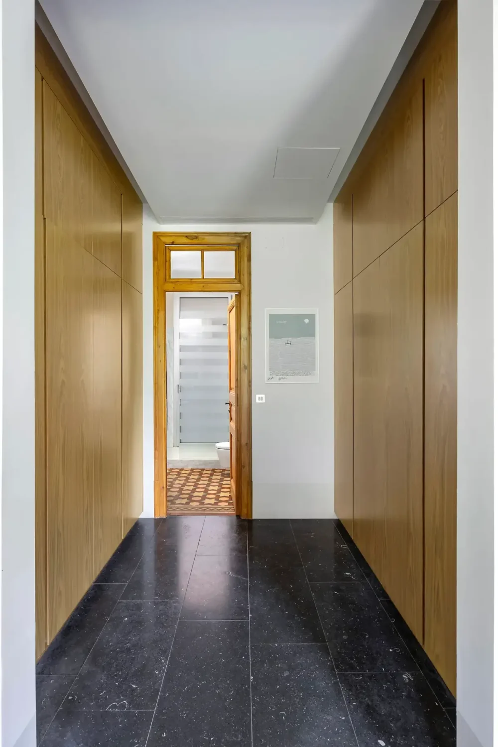 Historic Architecture and Modern Design in a Barcelona Apartment 9 wardrobe rooms black tile floor