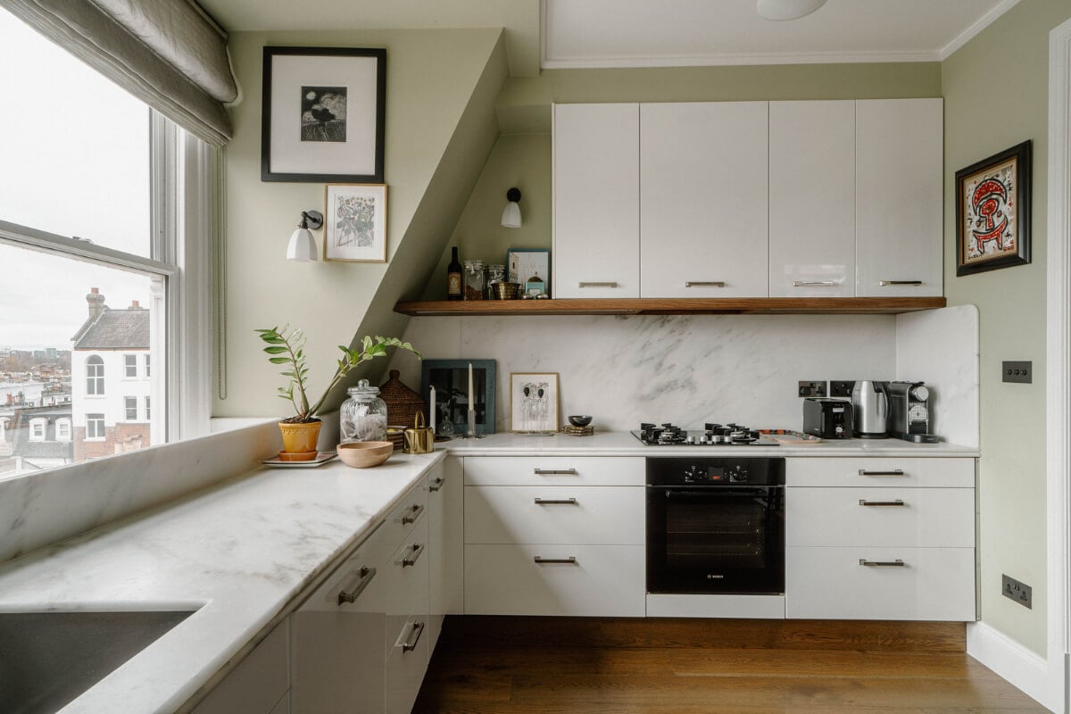 A Cozy Art-Filled Attic Apartment in London 10 white and marble kitchen